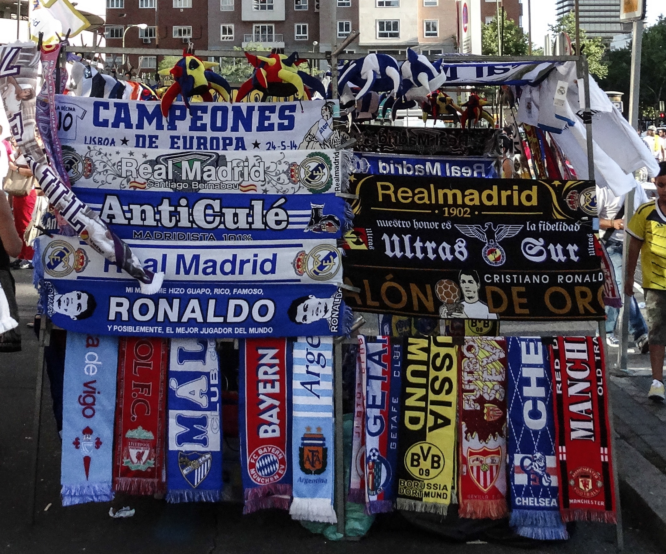 Scarves from Real Madrid, Bayern Munich, and other European clubs on display outside the stadium